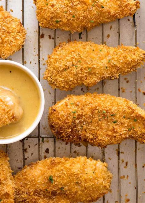 Tender pieces of chicken breast coated in panko and baked . . Crispy oven baked chicken breast strips